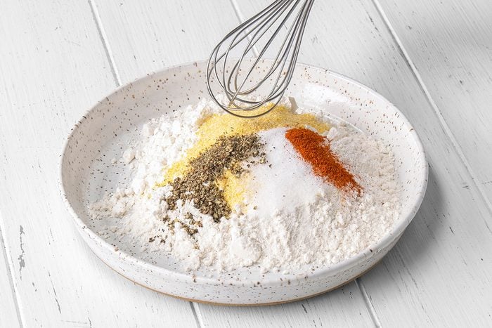Combine flour, cornmeal, salt, pepper and cayenne; place on a shallow plate.
