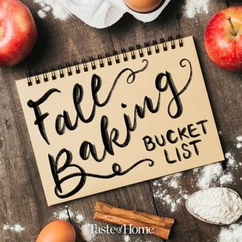 "Fall Baking Bucket List" written on a notebook on a dark wood background, surrounded by flour eggs, apples, and cinnamon sticks
